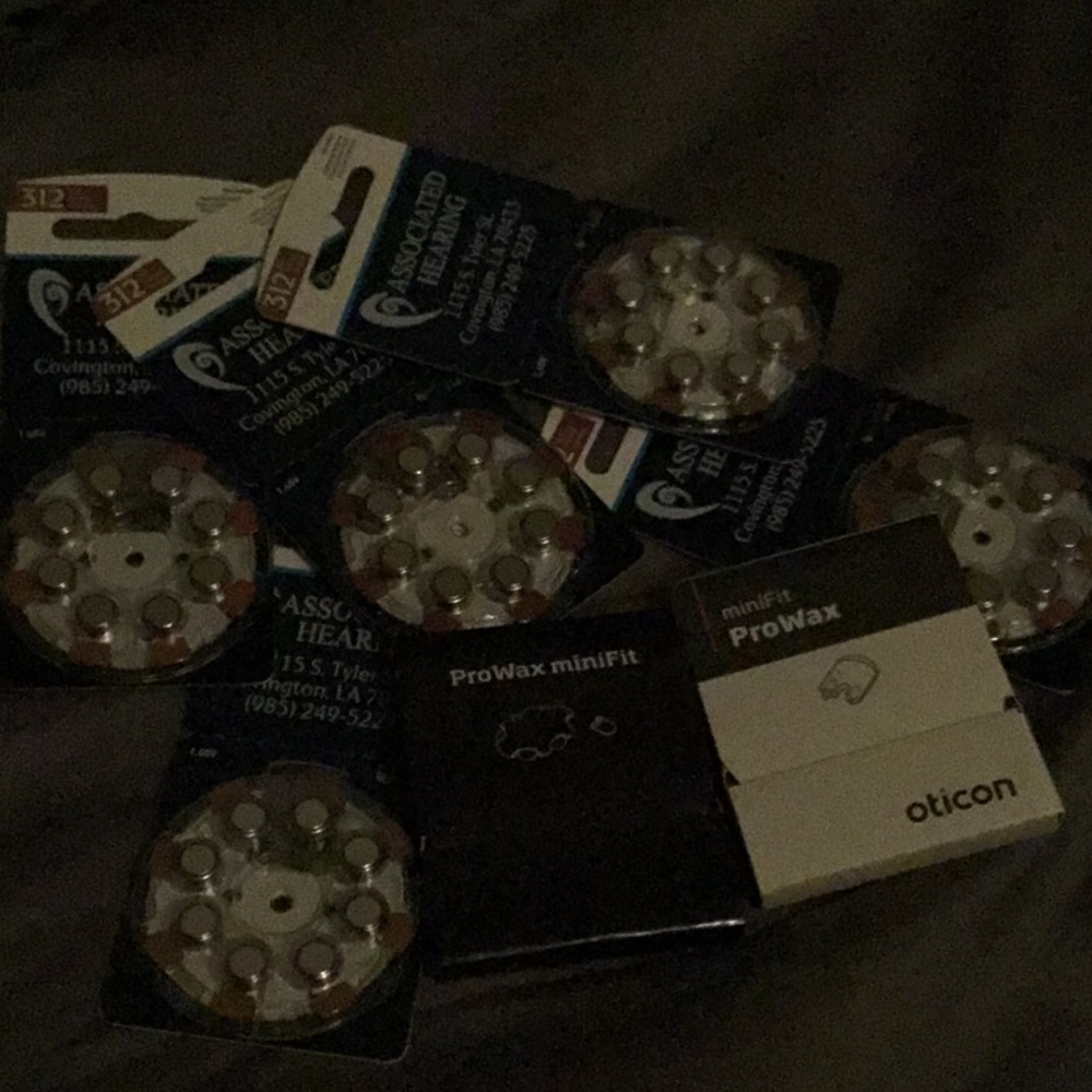 New in package hearings aid batteries 5 packs and  minifit pro wax 2 pack